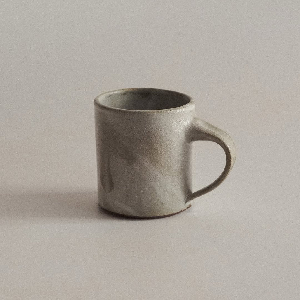 Gray ceramic mug on a plain background
